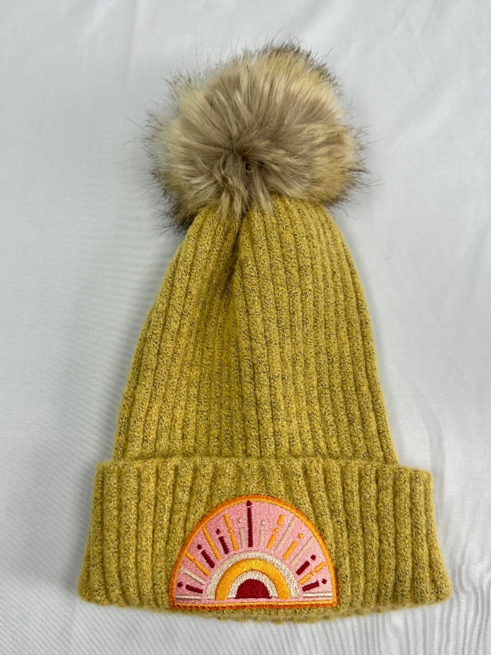 Childs Beanie with Sunrise Patch and Fur covered Pom Pom. Wool.